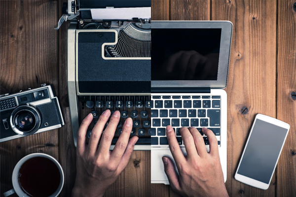 A photo of someone typing on a laptop