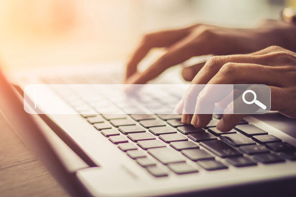 An image of hands typing on a keyboard