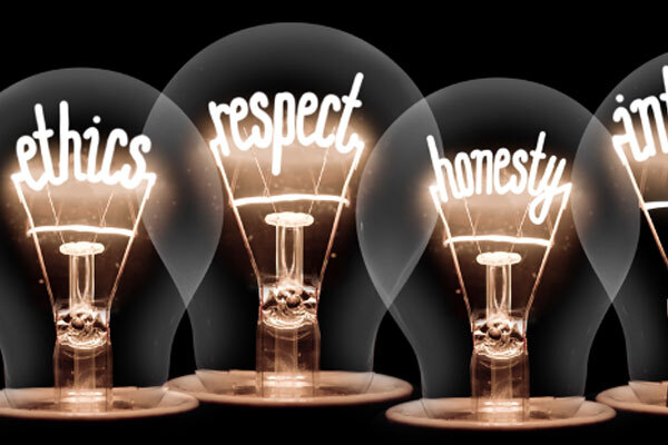 Image of four light bulbs that say ethics respect honesty and integrity