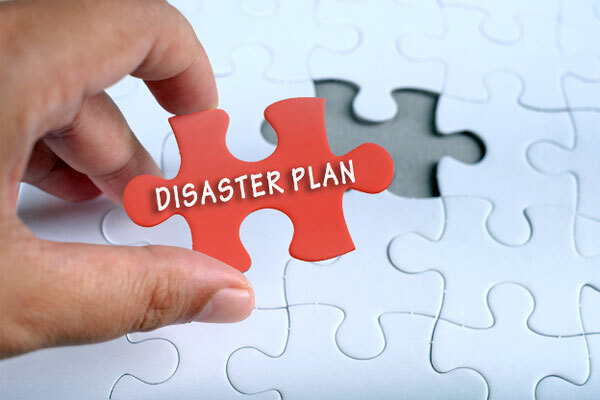 Image of a puzzle with a piece that says 'disaster plan'