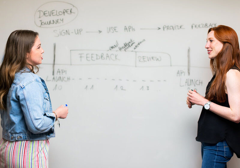Photo of two team members working on a marketing strategy